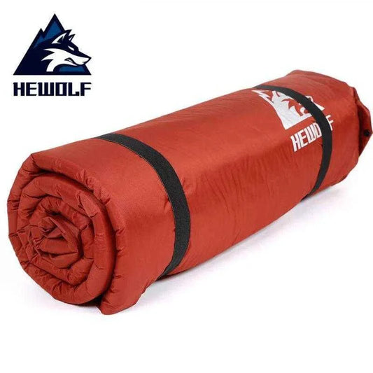 HEWOLF 2+1 Spliced Inflatable Camping Mattress, red, rolled for portability.