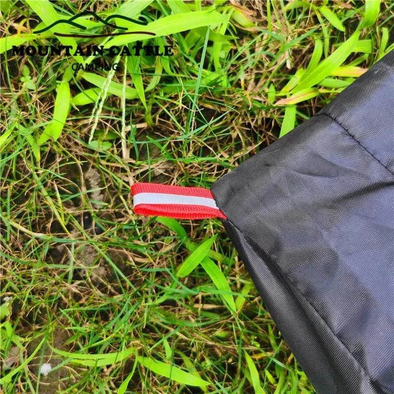 Mountain Cattle Ultralight Pyramid Tent on grass, showcasing durable 210T tear-resistant plaid fabric.