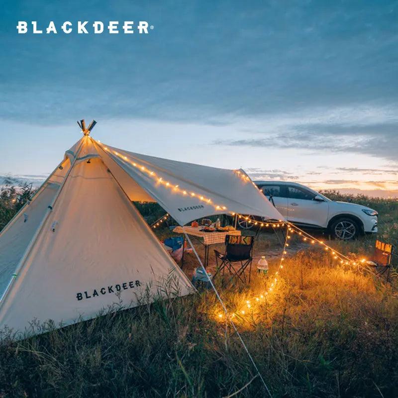 BLACKDEER solar string lights illuminating a tent in an outdoor setting.