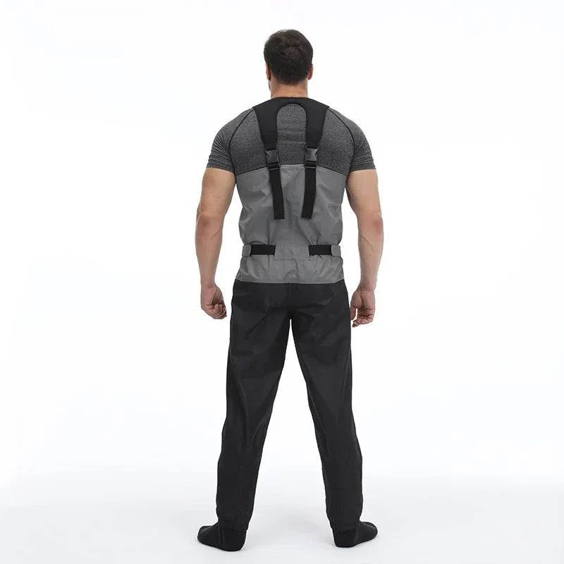 Man wearing KING-QPROOF breathable fishing chest waders, showcasing adjustable straps for comfortable fit.