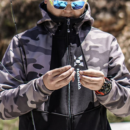 Person wearing a camouflage jacket with a brand logo, holding fishing equipment.
