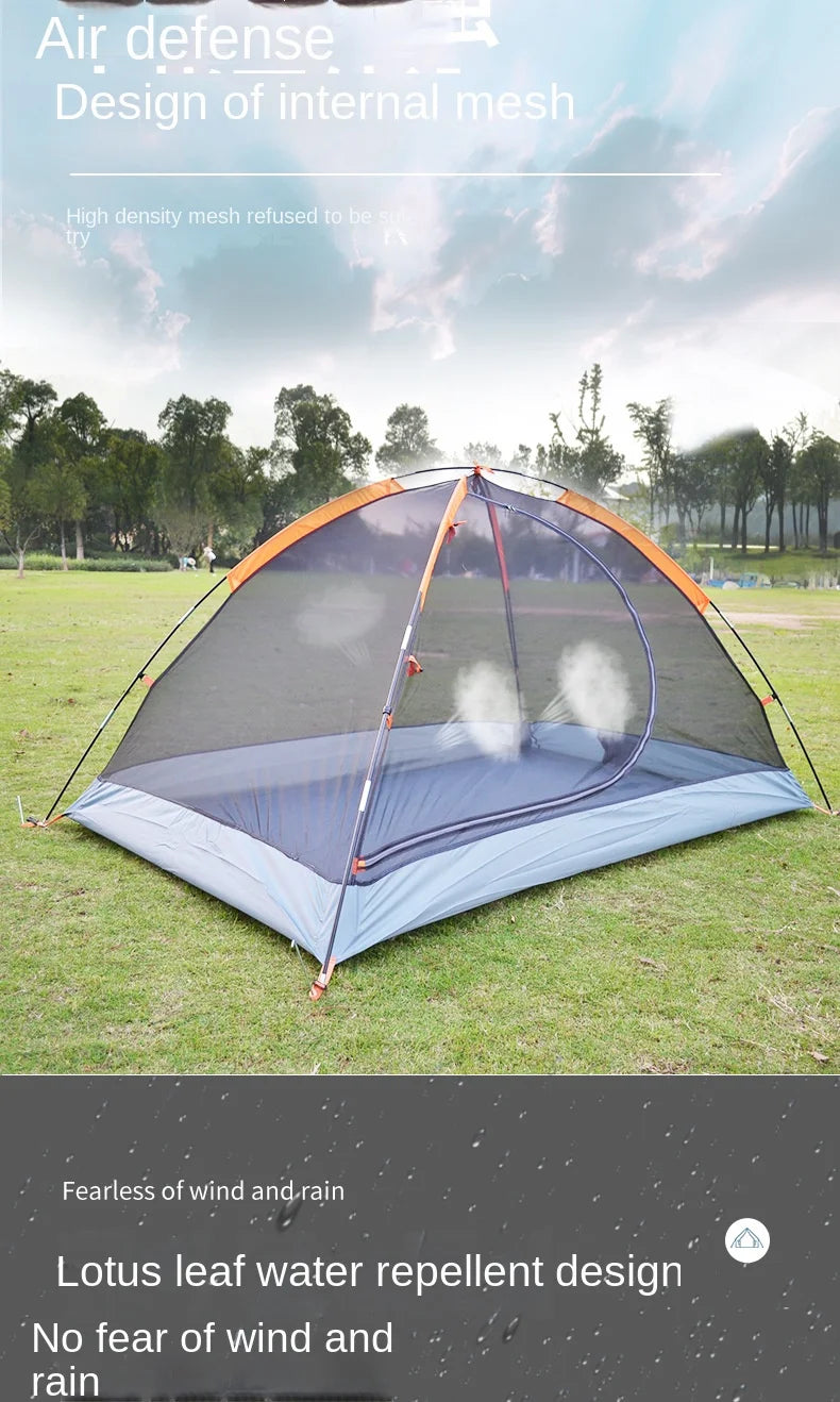 Outdoor tent with a mesh design on grassy area with trees in the background
