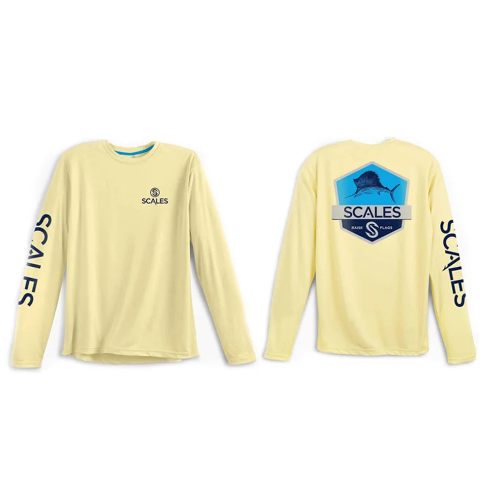 A pale yellow long-sleeve performance shirt shown from both front and back. The front features a small circular logo and the brand name 'SCALES' on the left chest, while the back displays a large blue and gray marlin graphic with 'SCALES' and 'LIMITED EDITION' text.