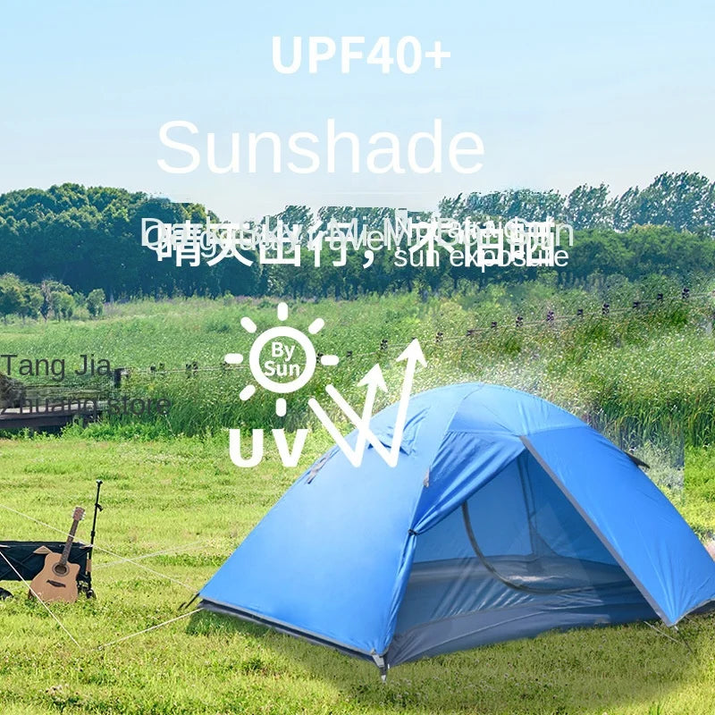 Blue tent with sunshade feature in a grassy field